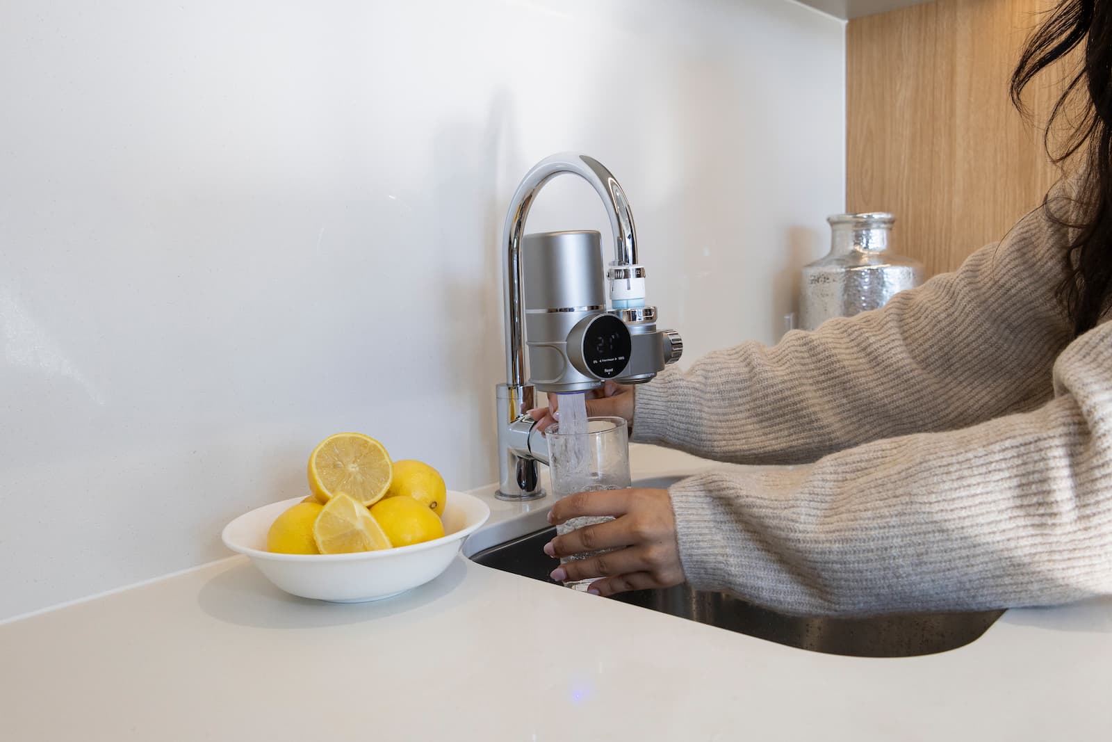 Installation views showing the filter on a kitchen sink